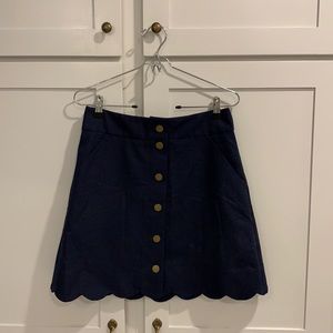 Scalloped navy skirt—excellent condition.